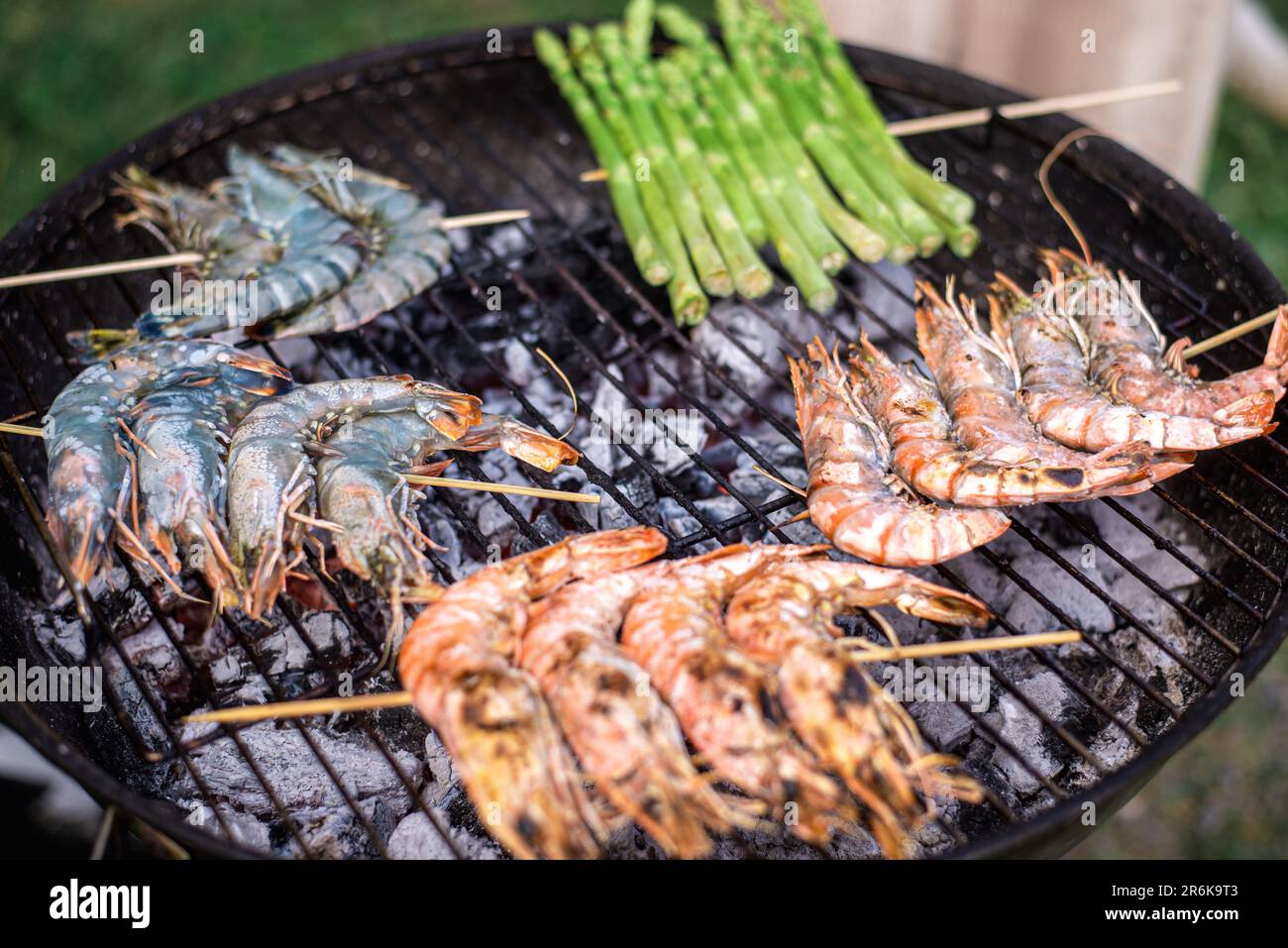 Grilling large king prawns. Charcoal-grilled shrimp. Stock Photo