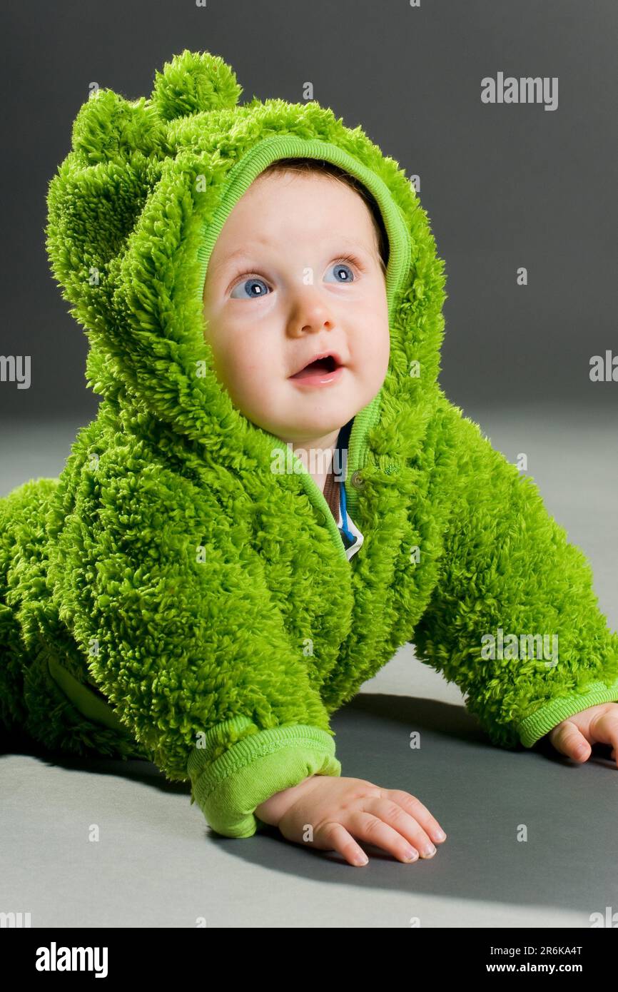 A cute cute baby in a furry frog costume Stock Photo Alamy