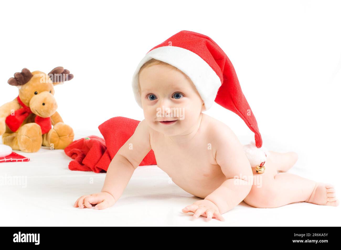 Cute baby with christmas hat and moose on white background Stock Photo