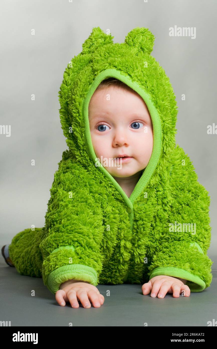A cute cute baby in a furry frog costume Stock Photo Alamy
