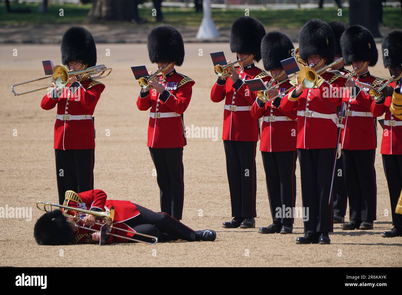 A trombone player in the military band faints during the Colonel's