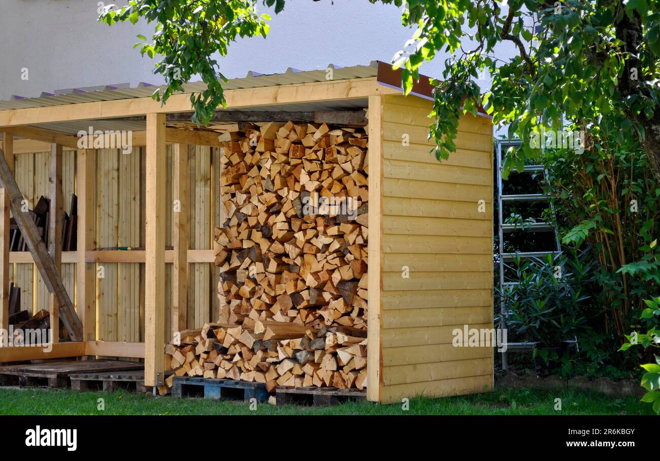 Split firewood in the shed Stock Photo Alamy