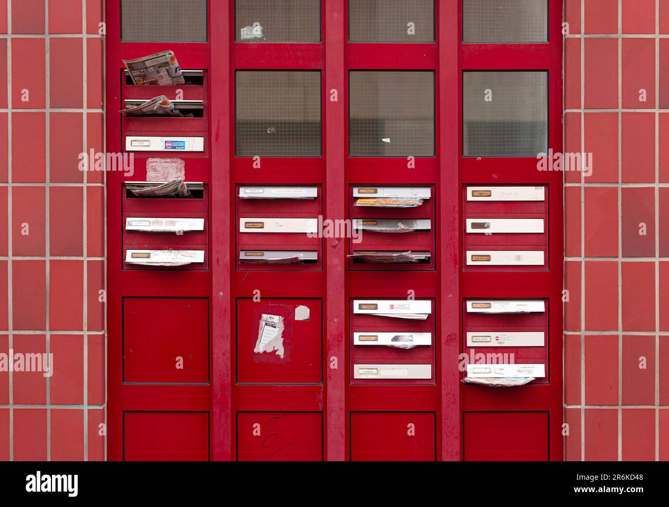 Red post boxes with a message written in each window on their red