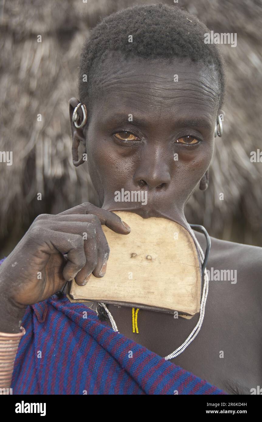 Surma woman with triangular lip plate, lip plate, Kibish, Omo Valley