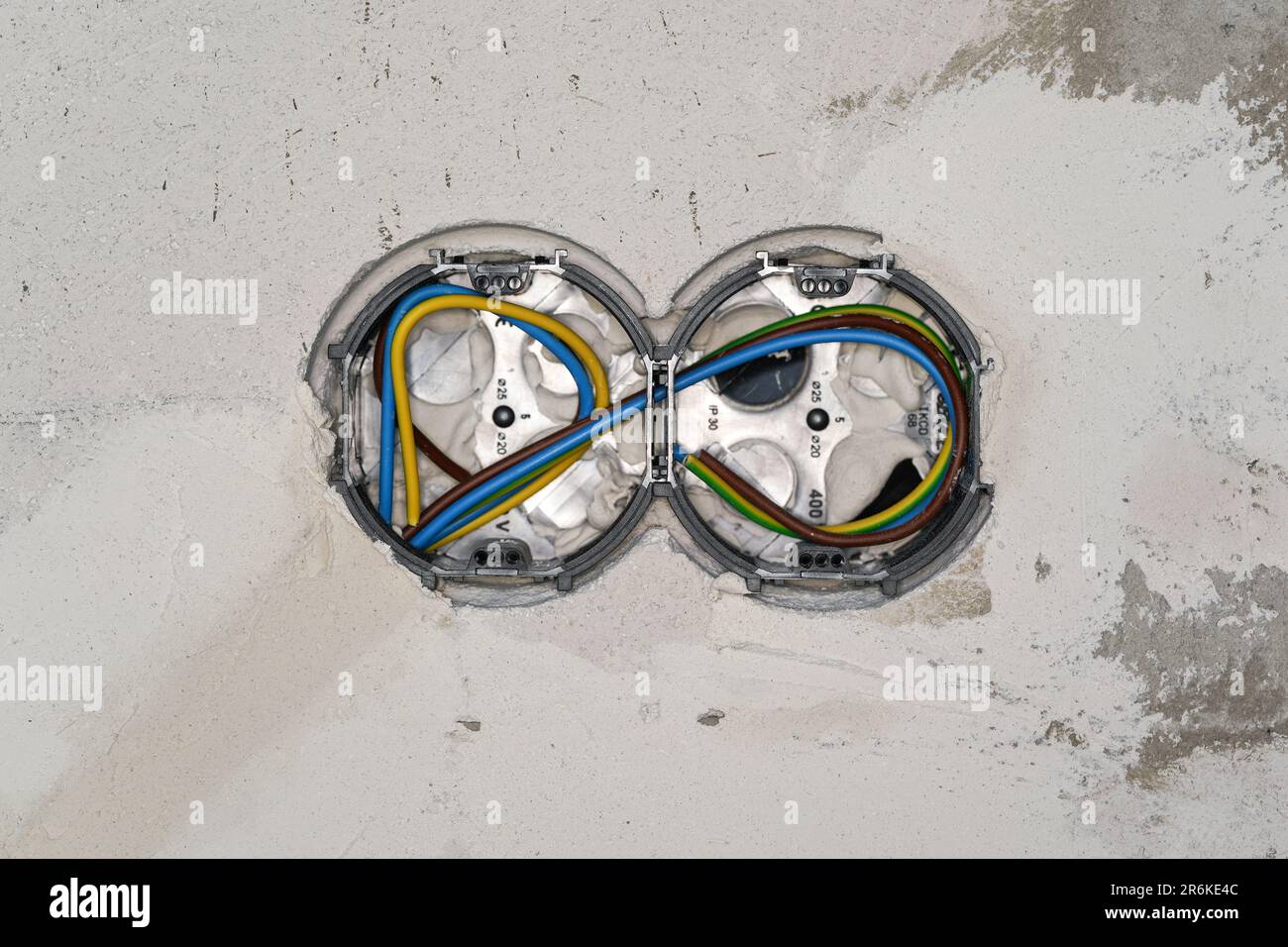 Boxes with cables for electric sockets installed in new house building