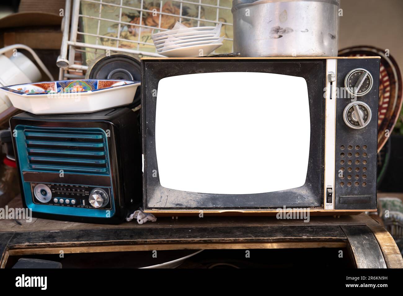 Old TV set mockup next to an old receiver in a junk shop Stock Photo