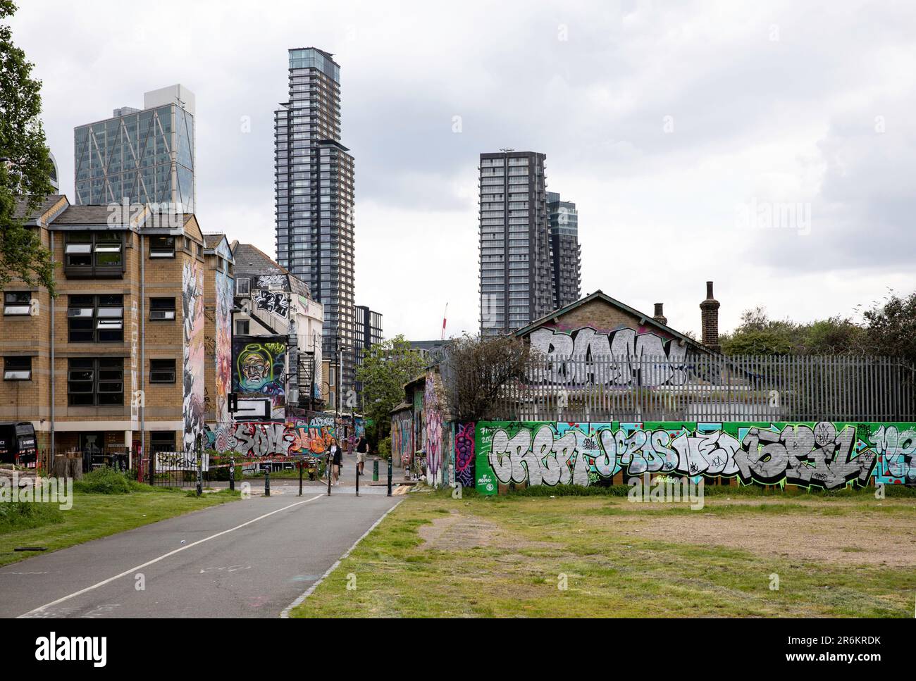 London, UK - May 17 2023: Looking towards Brick Lane from Allen Gardens in Shoreditch. The gritty inner city area is covered in graffiti. Stock Photo