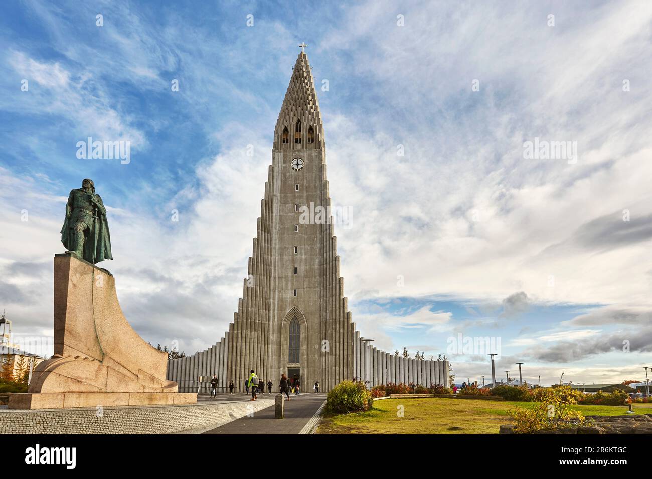 The spire of Hallgrimskirkja Church, fronted by a statue of Leifur Eriksson, founder of Iceland, in central Reykjavik, Iceland, Polar Regions Stock Photo