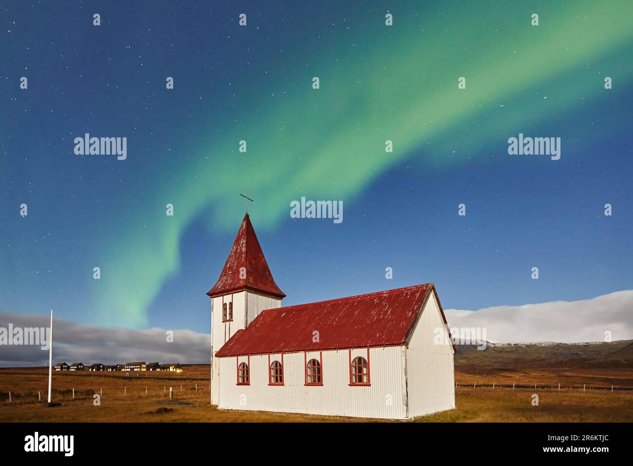 Night sky and Northern Lights (Aurora Borealis) over the church in the village of Hellnar, in Snaefellsjokull National Park, Snaefellsnes peninsula Stock Photo