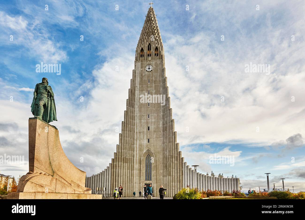 The spire of Hallgrimskirkja Church, fronted by a statue of Leifur Eriksson, founder of Iceland, in central Reykjavik, Iceland, Polar Regions Stock Photo