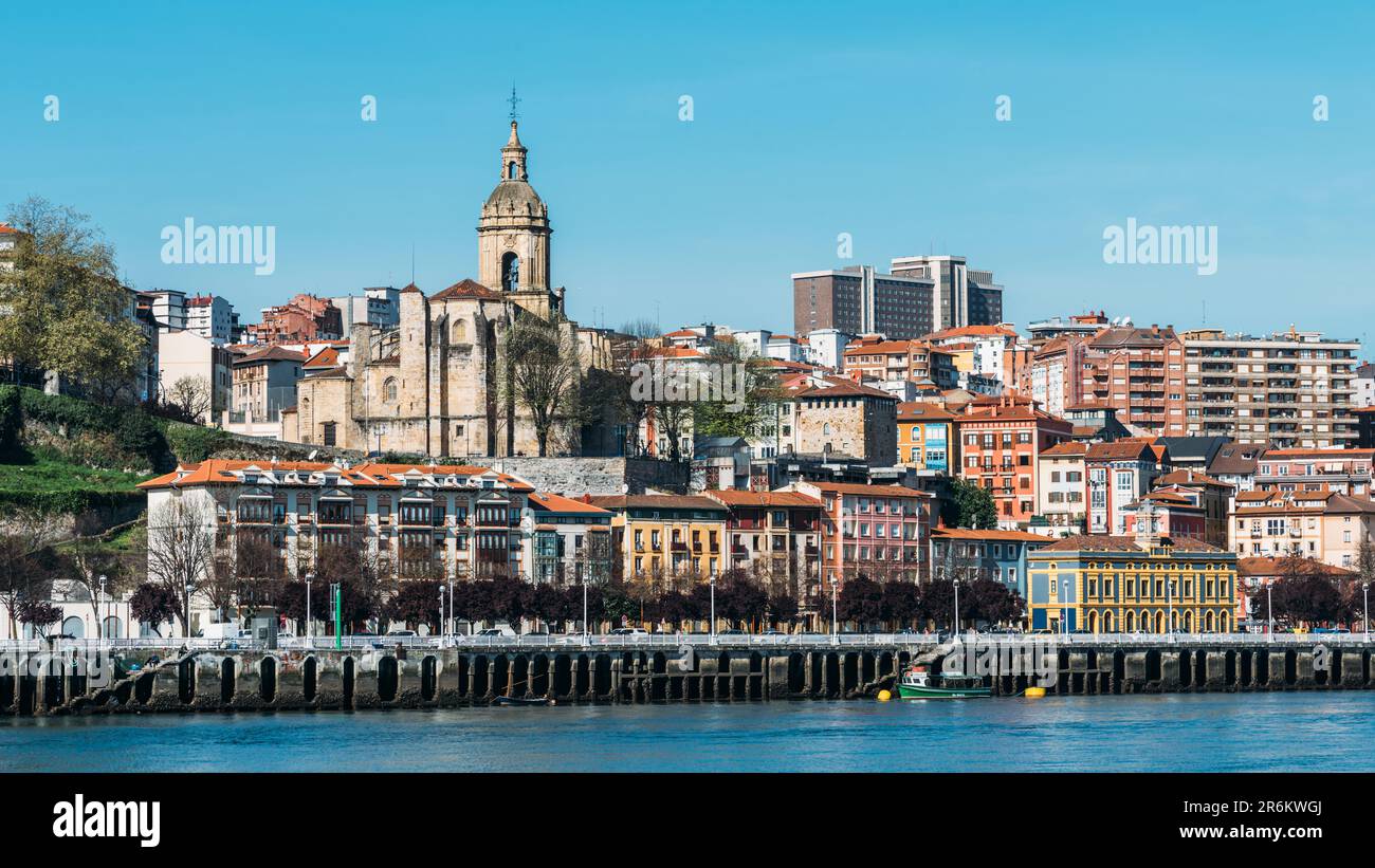 Andra Maria Basilika next to the River Nervion promenade in Portugalete, Bilbao, Basque Country, Spain, Europe Stock Photo