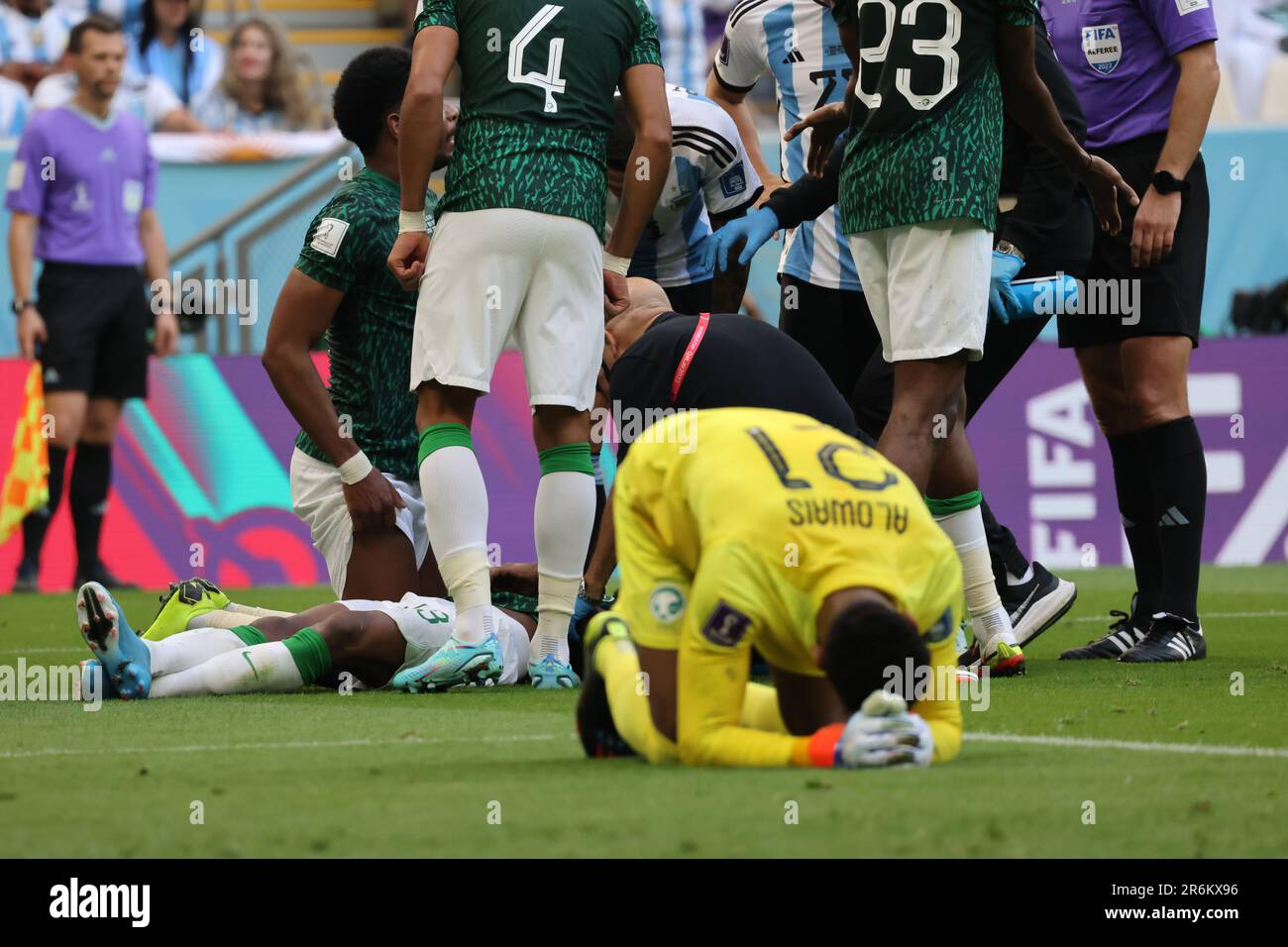 Lusail, Qatar, 22, November, 2022. Mohammed Al Owais cries when injuring his partner during the match between Argentina National Team vs. Saudi Arabia Stock Photo