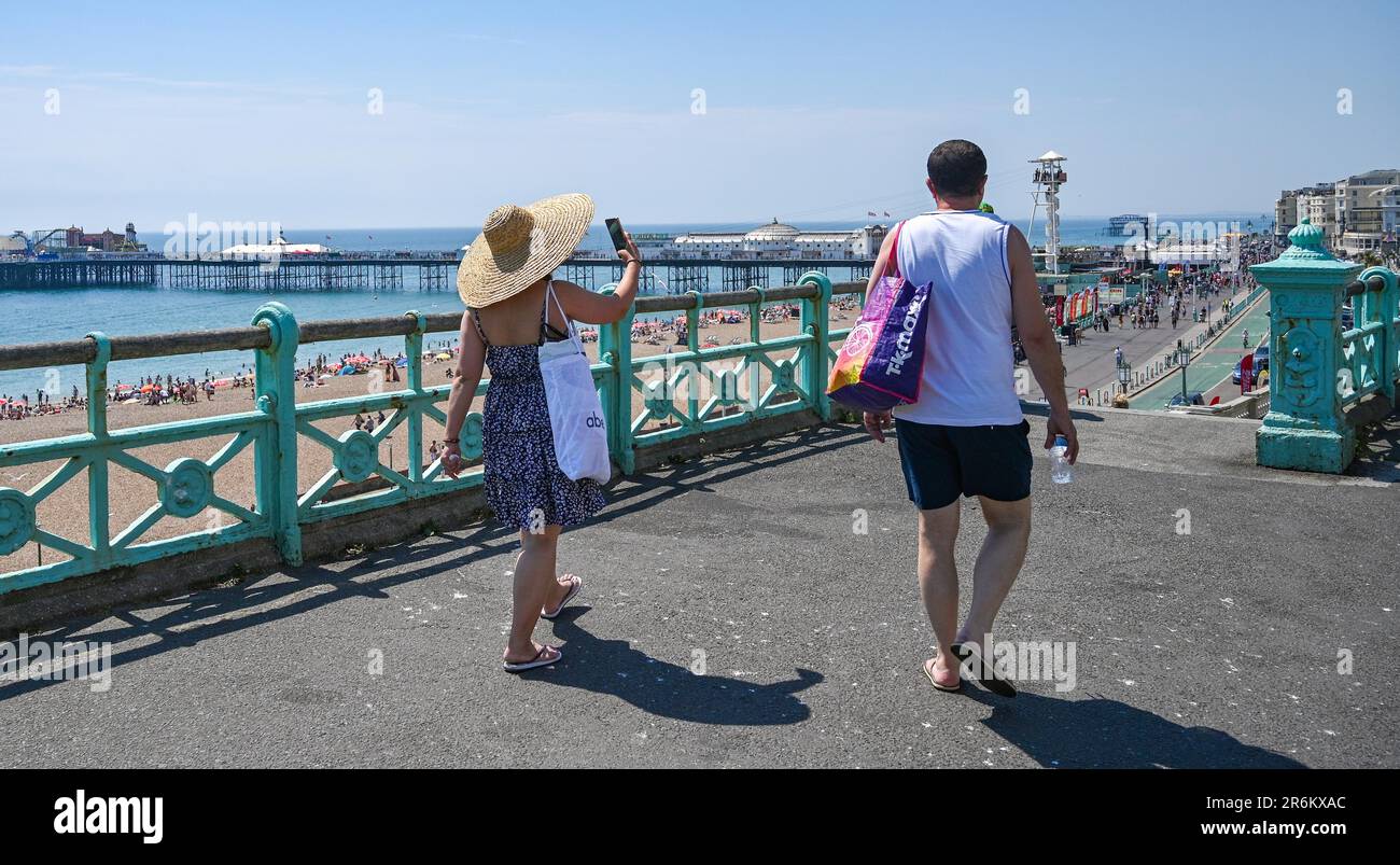Brighton UK 10th June 2023 - Crowds flock to Brighton beach as they enjoy the beautiful hot sunshine with temperatures forecast to reach 30 degrees in some parts of the UK and heat warnings being issued  : Credit Simon Dack / Alamy Live News Stock Photo