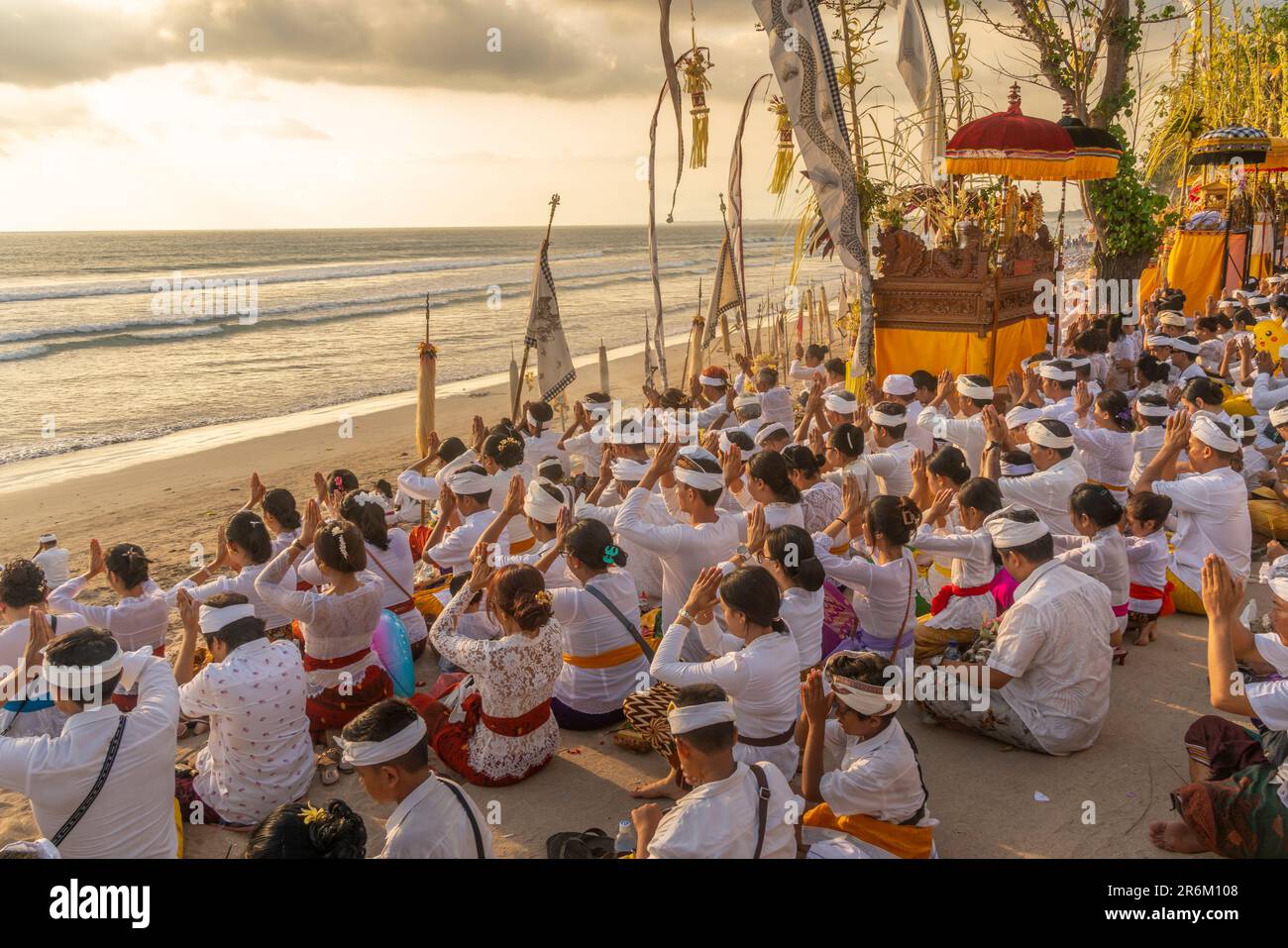 View of people at prayer on Kuta Beach for Nyepi, Balinese New Year Celebrations, Kuta, Bali, Indonesia, South East Asia, Asia Stock Photo
