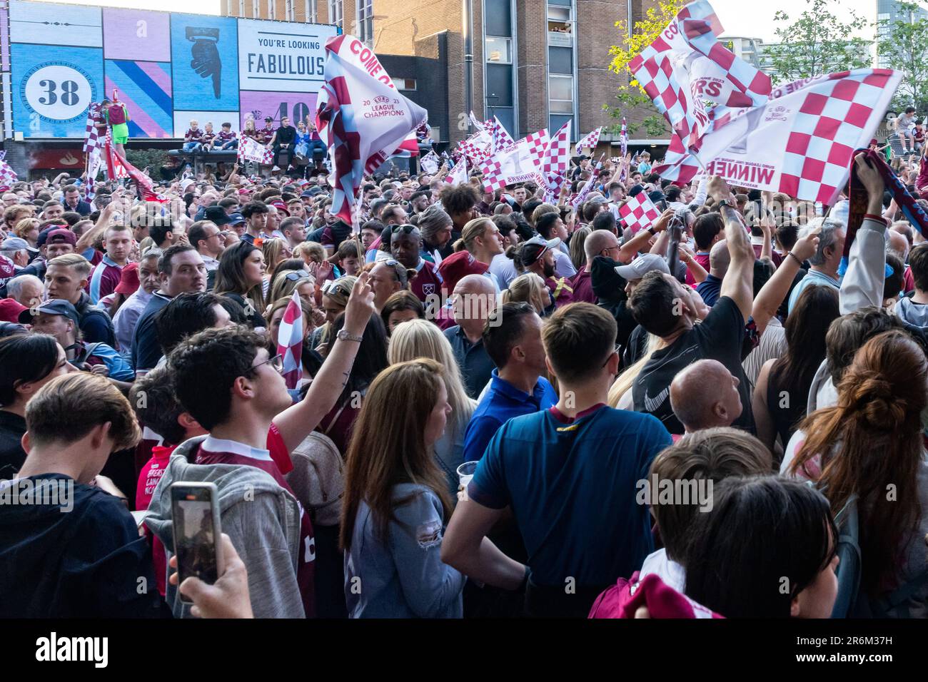 London, UK. 8th June, 2023. Supporters of West Ham United gather outside Stratford Town Hall to await the arrival of the team following a UEFA Europa Conference League victory parade from the site of the club's former Boleyn Ground stadium in Upton Park. West Ham defeated ACF Fiorentina in the UEFA Europa Conference League Final on 7 June, winning their first major trophy since 1980. Credit: Mark Kerrison/Alamy Live News Stock Photo