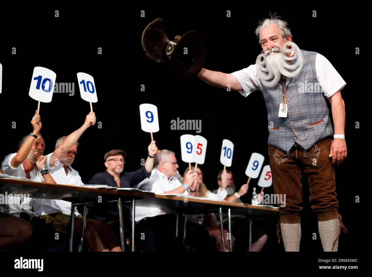 Burghausen, Germany. 10th June, 2023. A participant in the category 'Chinbeard Freestyle' receives the score from the jury, on the second day of the World Beard and Mustache Championships in the Stadtsaal Burghausen. Credit: Uwe Lein/dpa/Alamy Live News Stock Photo