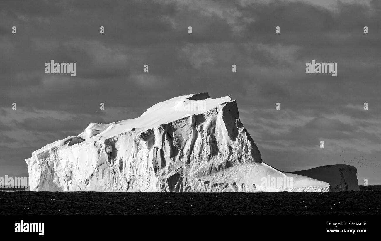 Tilted Fragment of Tabular Iceberg in Bellingshausen Sea, Antarctica Stock Photo
