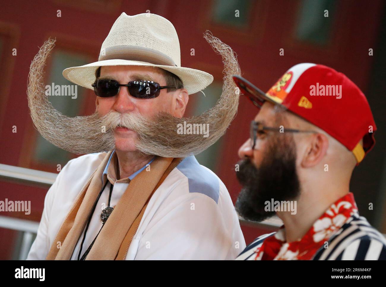 Burghausen, Germany. 10th June, 2023. Two participants chat on the second day of the World Beard and Mustache Championships in the Stadtsaal Burghausen. Credit: Uwe Lein/dpa/Alamy Live News Stock Photo