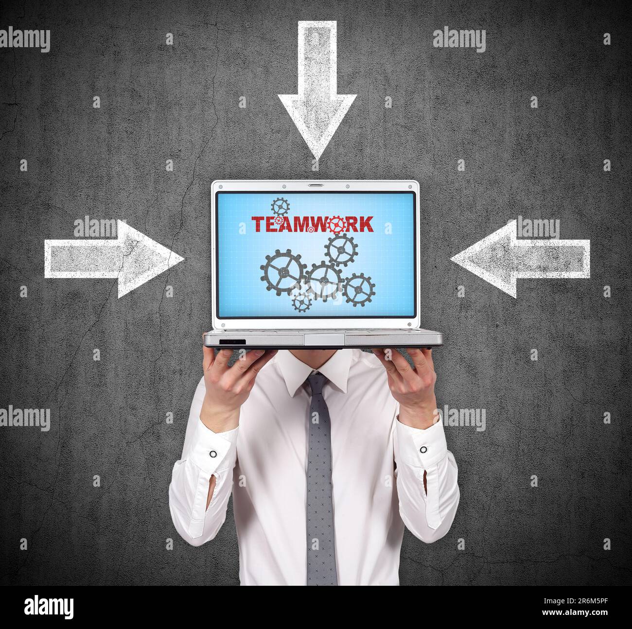 businessman holding laptop with teamwork concept Stock Photo