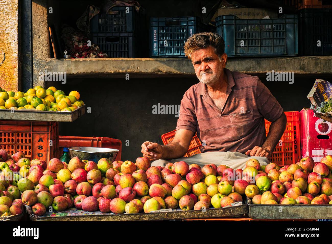 Fruit seller in his shop in Sadar Market. Jodhpur, Rajasthan, India Stock Photo