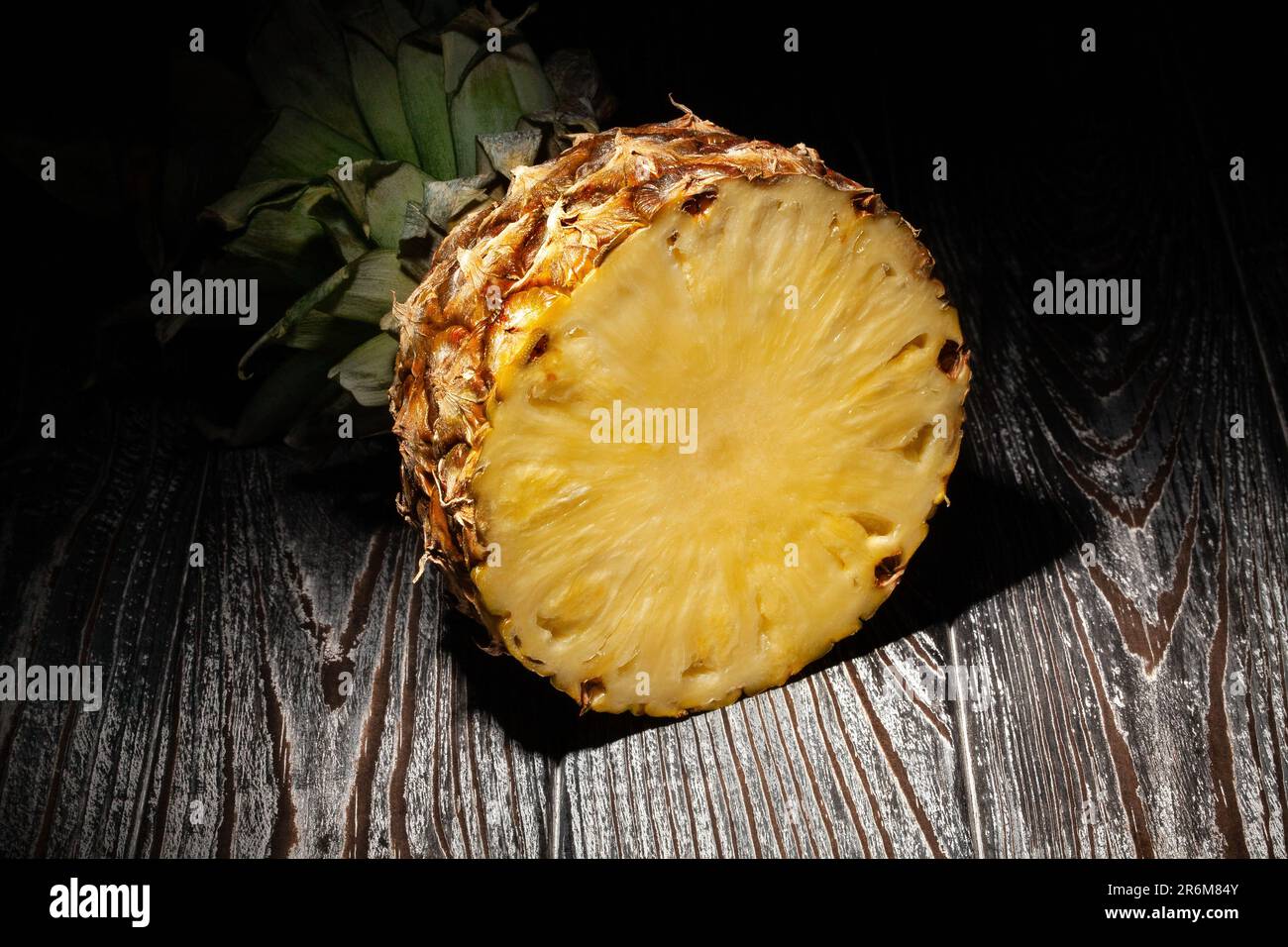 sliced pineapple on wood background Stock Photo