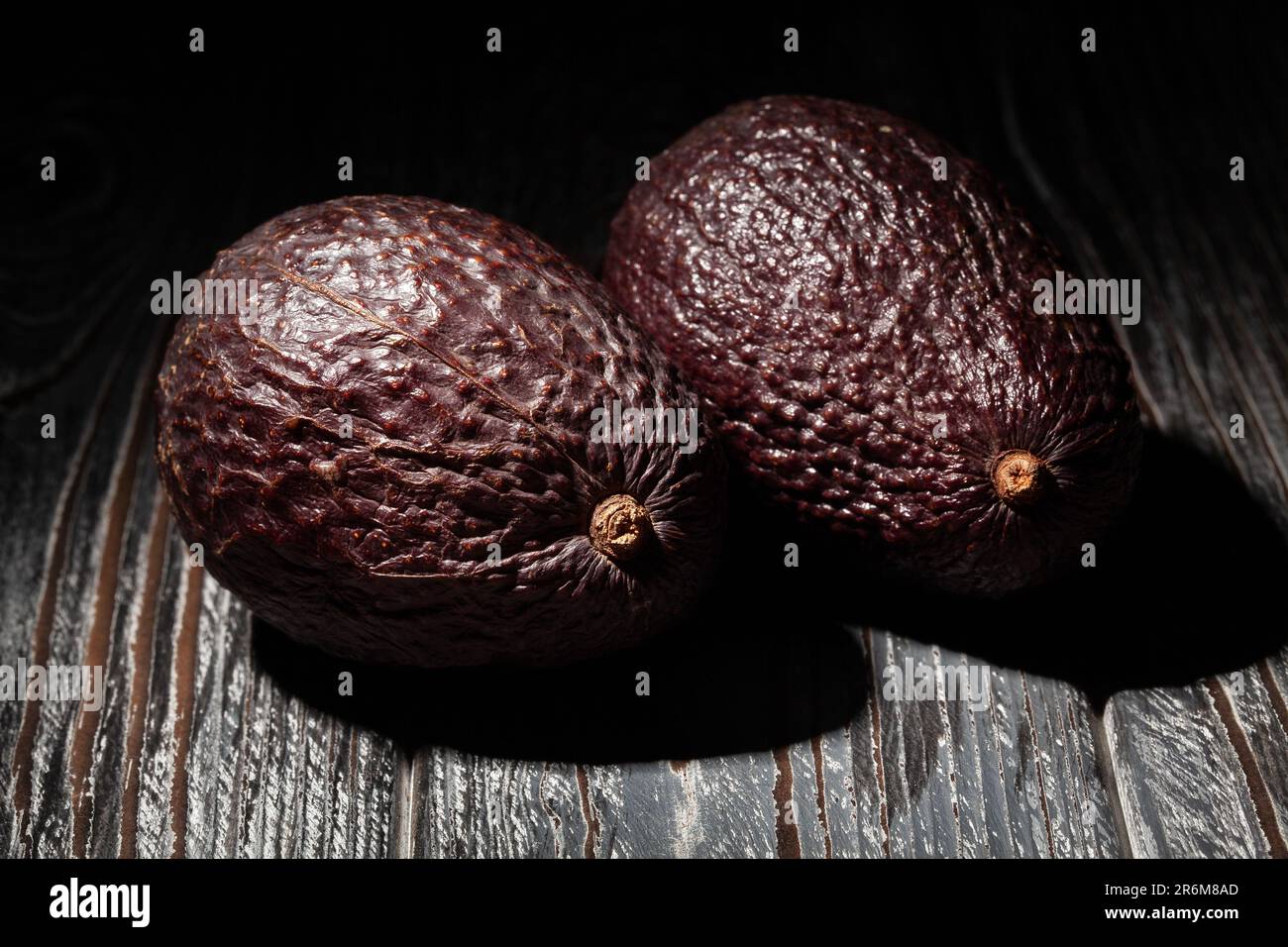 hass avocado on wood background Stock Photo
