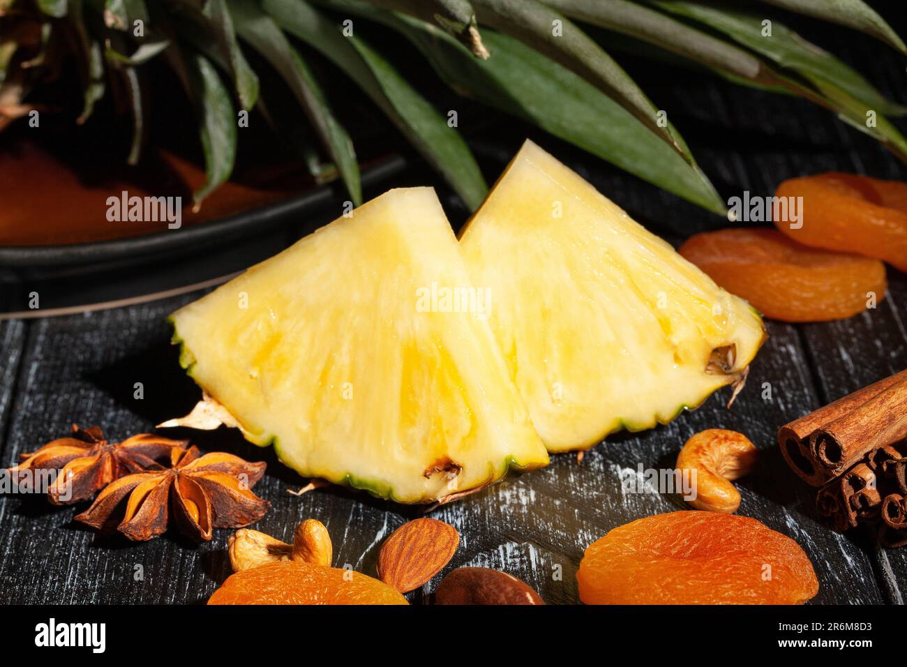 sliced pineapple on wood background Stock Photo