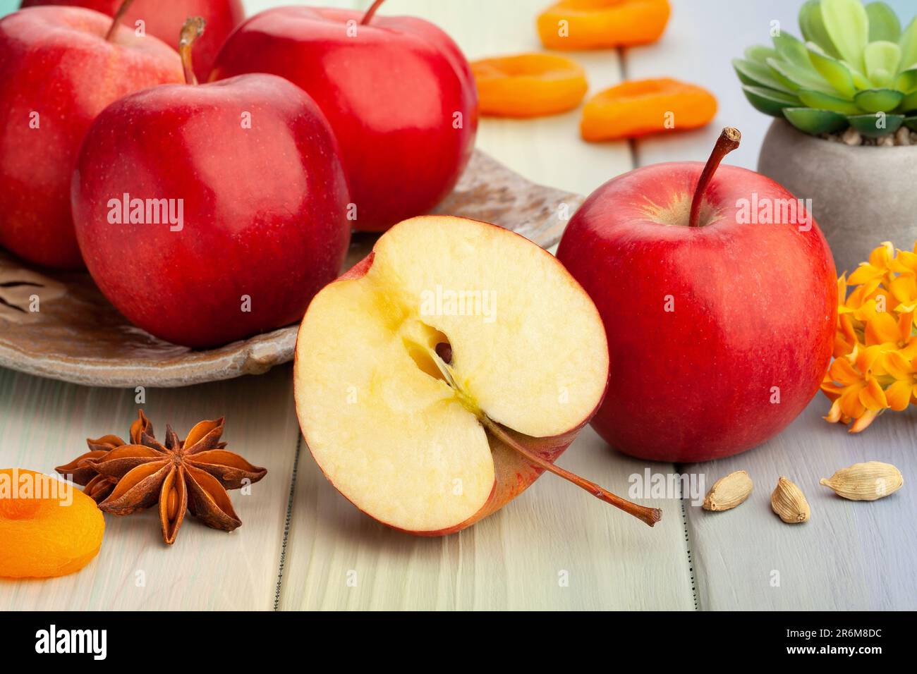 sliced red apples on wood background Stock Photo