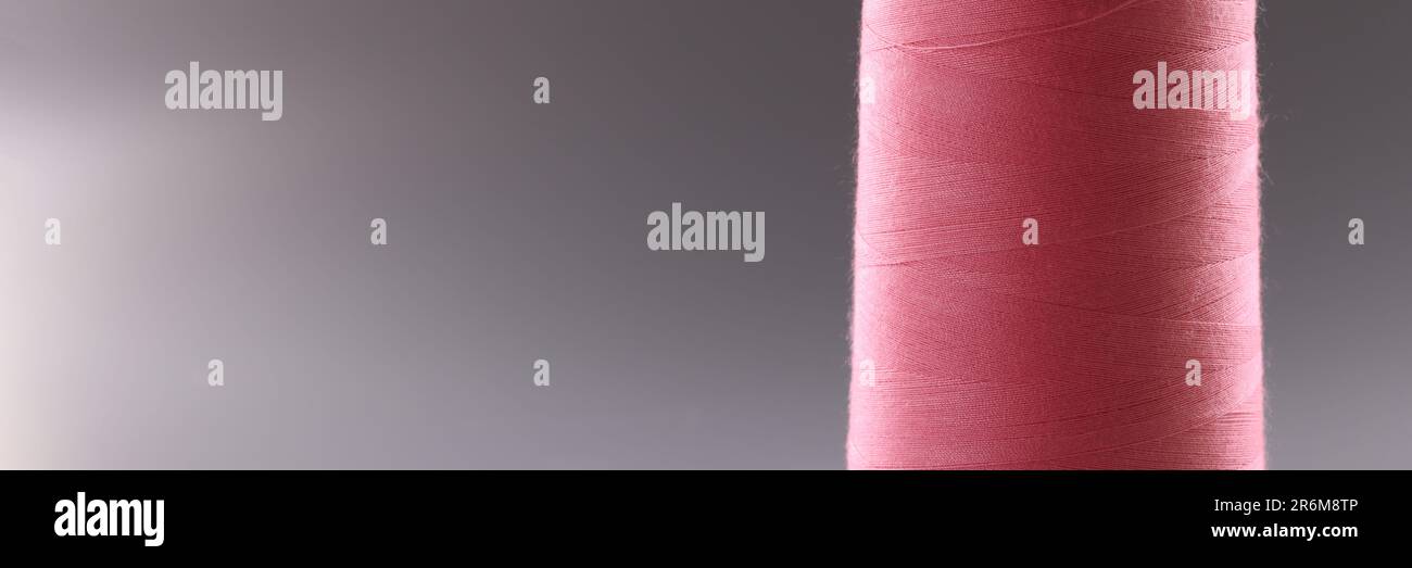 Threads of light pink color in coil Stock Photo - Alamy