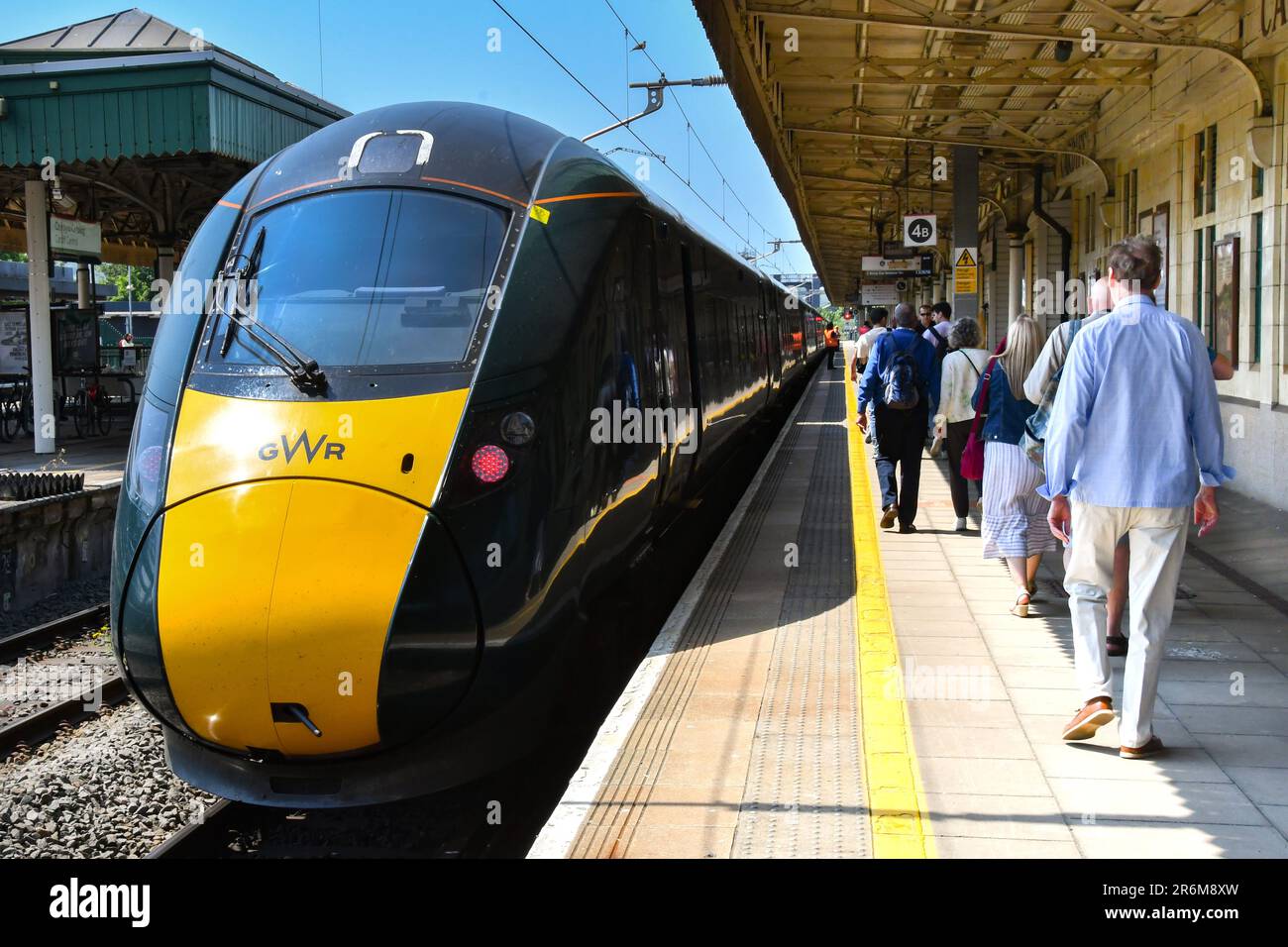 Cardiff, Wales - June 2023: High speed train operated by Great Western Railway at Cardiff Central railway station with passengers on the platform Stock Photo
