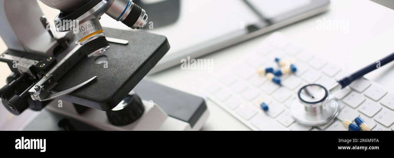 Tablets stethoscope and microscope with keyboard in laboratory Stock ...