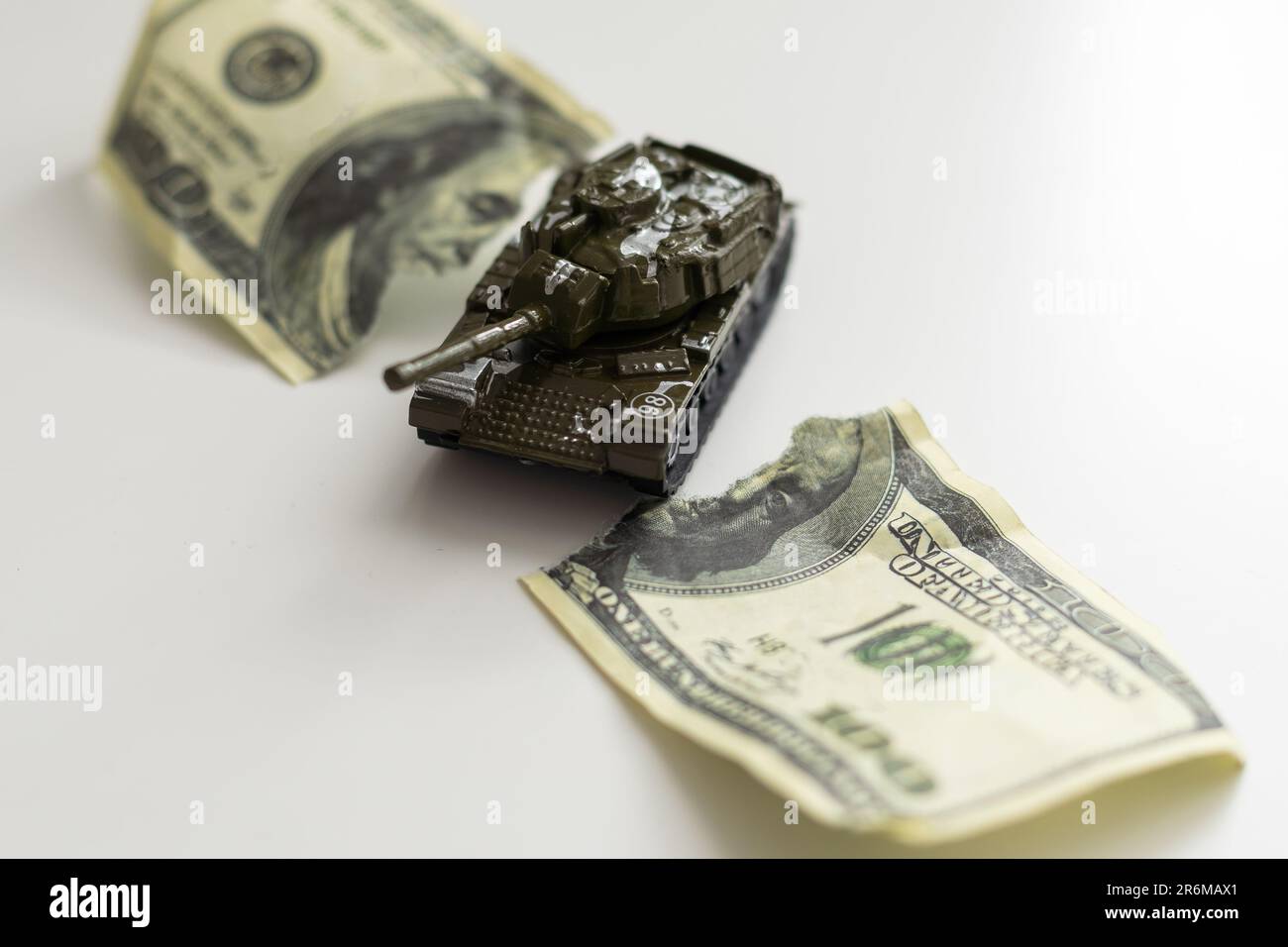 One Hundred Dollar Bill Ripped in Half Isolated on a White Background