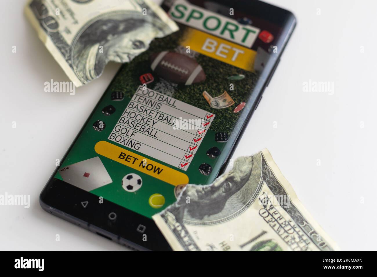 One Hundred Dollar Bill Ripped in Half Isolated on a White Background