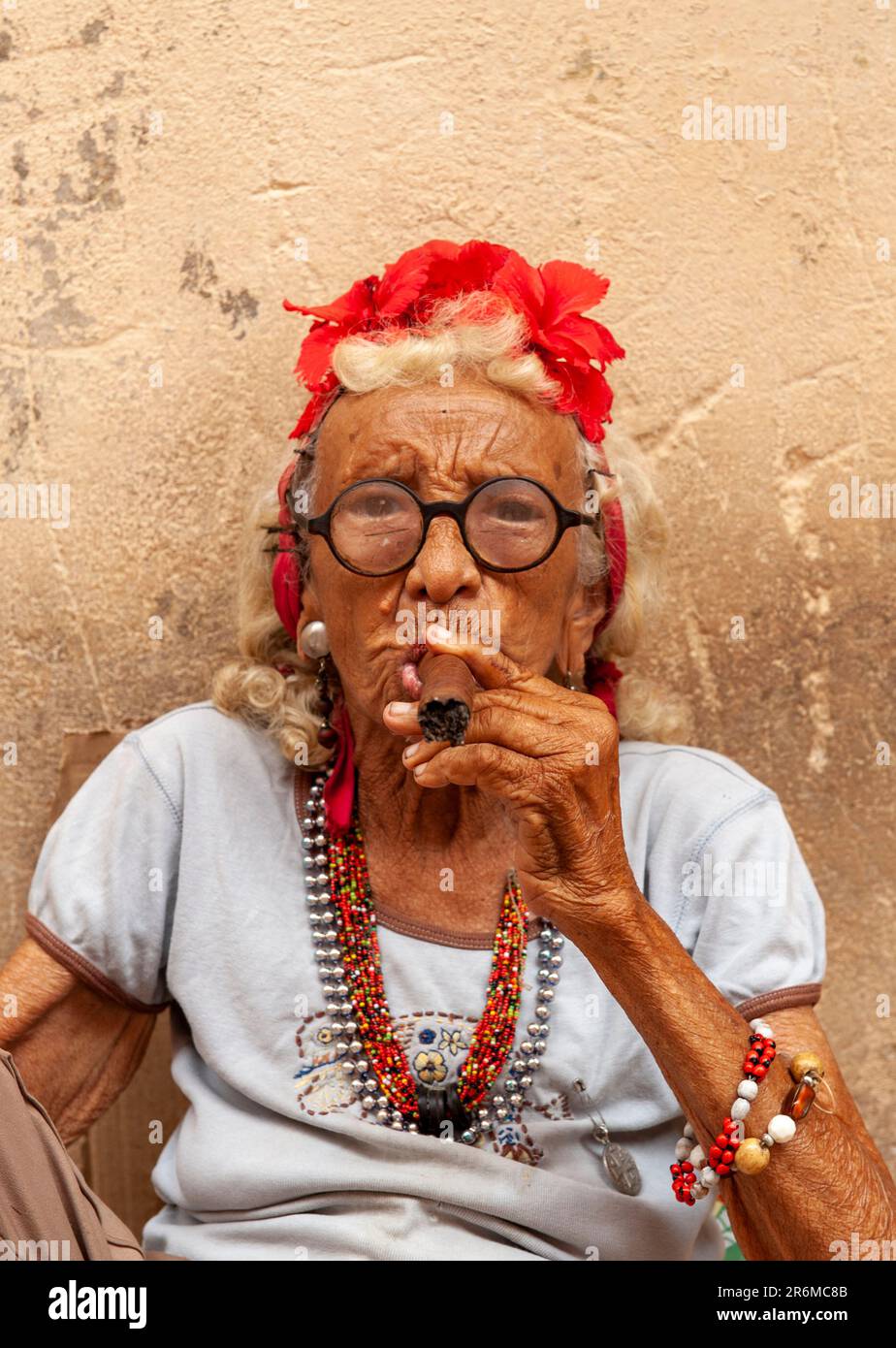 Havana, Cuba. An elderly artistic woman smokes a Cuban cigar. Stock Photo