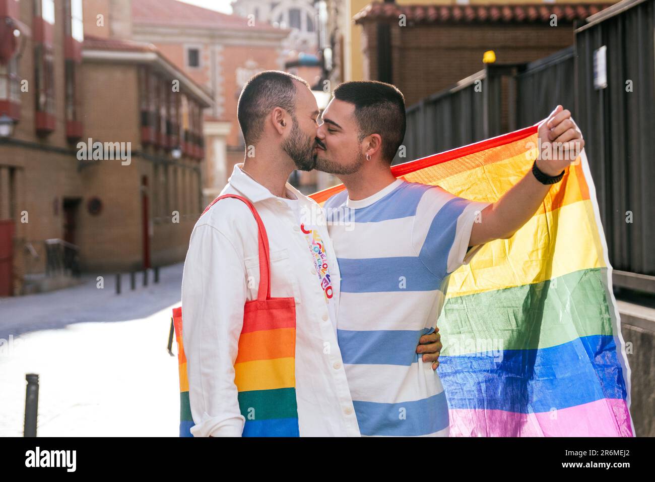 Sunny City Embrace: Gay Friends in Vibrant LGBT Accents Share a Passionate  Sunset Kiss Stock Photo - Alamy