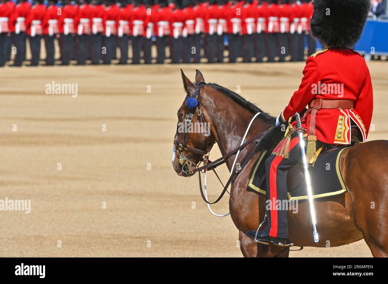 Horse Guards Parade, London, UK on June 10 2023. An officer looks on as HRH Prince William, The Prince of Wales reviews the regiments of the Household Divisions as the Regimental Colonel of the Welsh Guards during the Trooping the Colour at Horse Guards Parade, London, UK on June 10 2023. The Divisions on Parade include, the Foot guards; The Grenadier Guards, The Coldstream Guards, The Scots Guards, The Irish Guards, The Welsh Guards, with the Household Cavalry Mounted Regiment made up of The Life Guards and The Blues and Royals who together provide the Sovereign's Escort. Credit: Francis Knig Stock Photo
