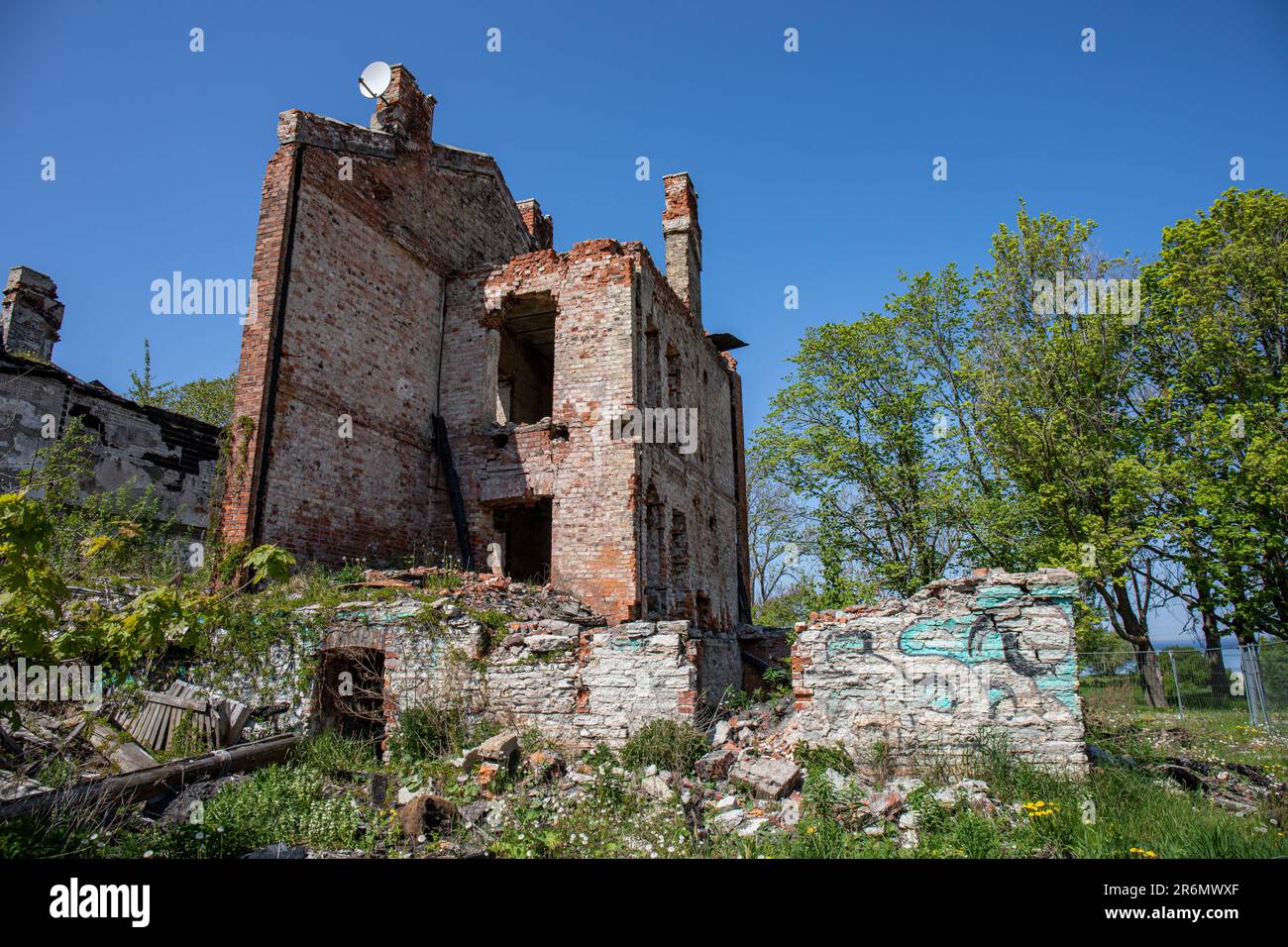 Ruins of an old residential building against clear blue sky at Kopli Lines or Kopli liinid in Tallinn, Estonia Stock Photo