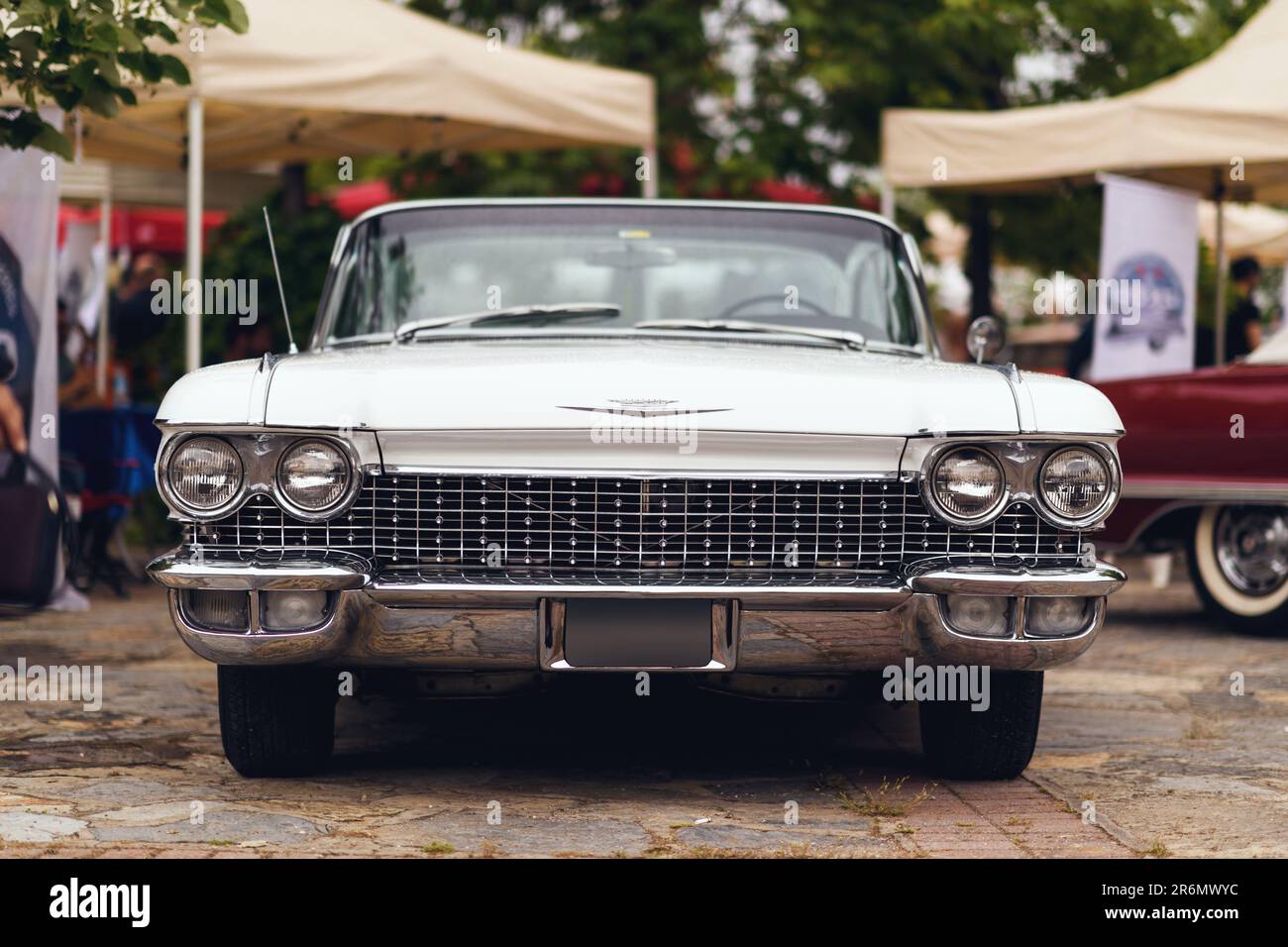 Izmir, Turkey - June 3, 2023: Frontal view of a white 1960 Cadillac on a rainy day at the IZKOD Classic Car Meet at Buca Pond in Izmir Stock Photo