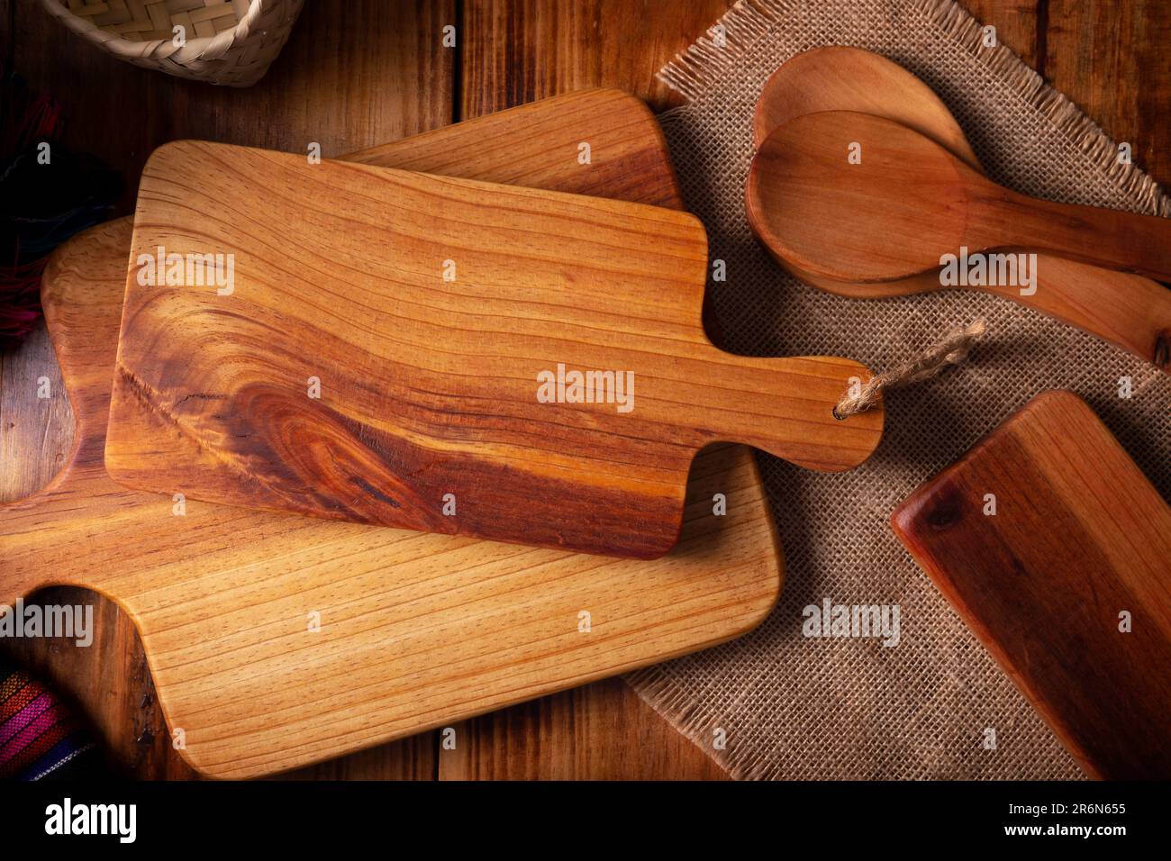 Empty rustic wooden cutting board for kitchen on old rustic wooden table. Table top view view. Stock Photo