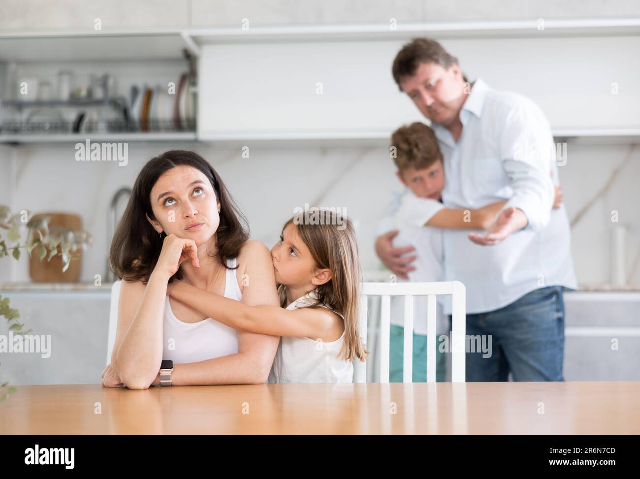 Domestic quarrel in big family - daughter hugging upset mom, son ...