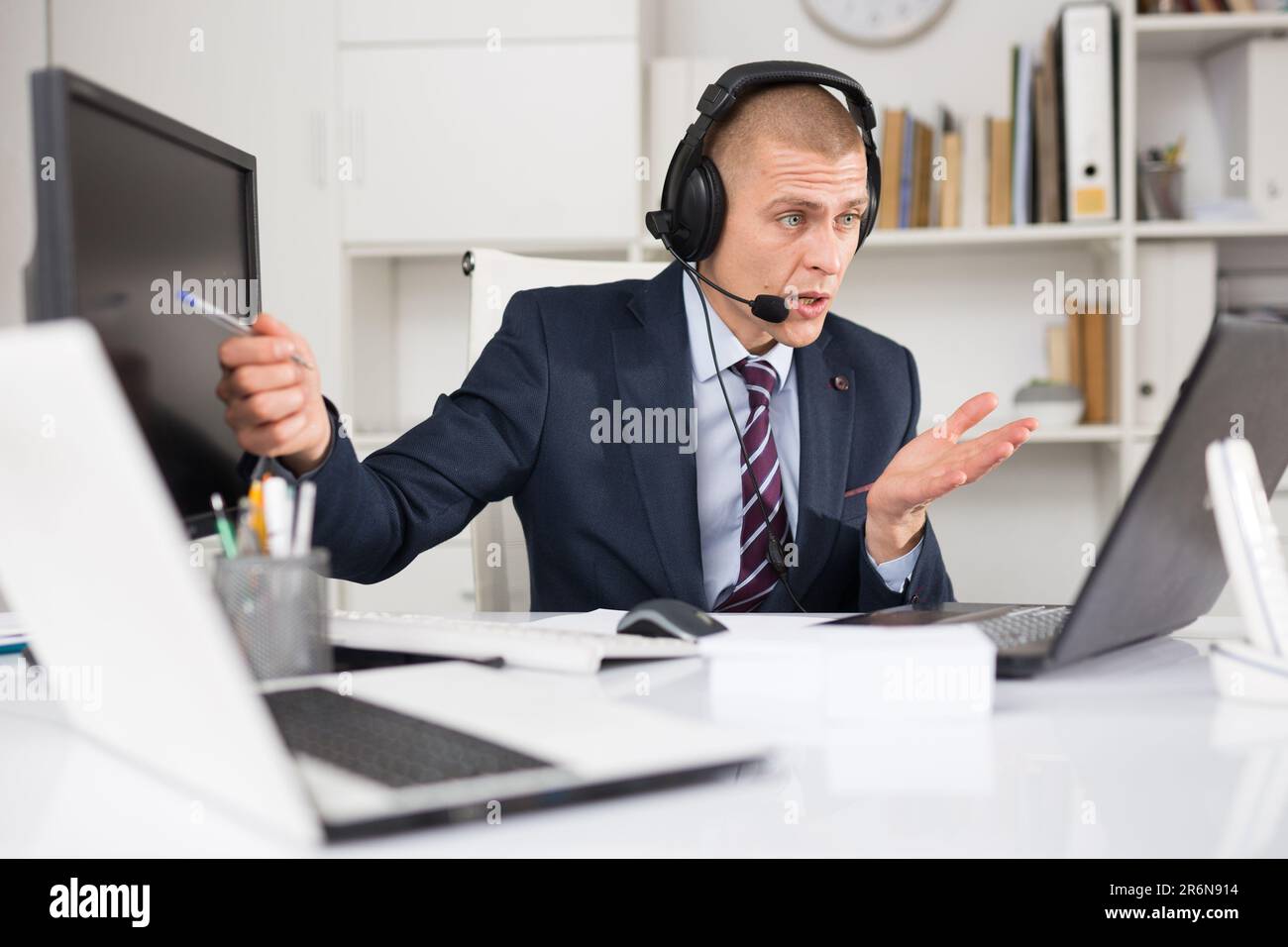 Portrait of friendly man call center operator Stock Photo - Alamy