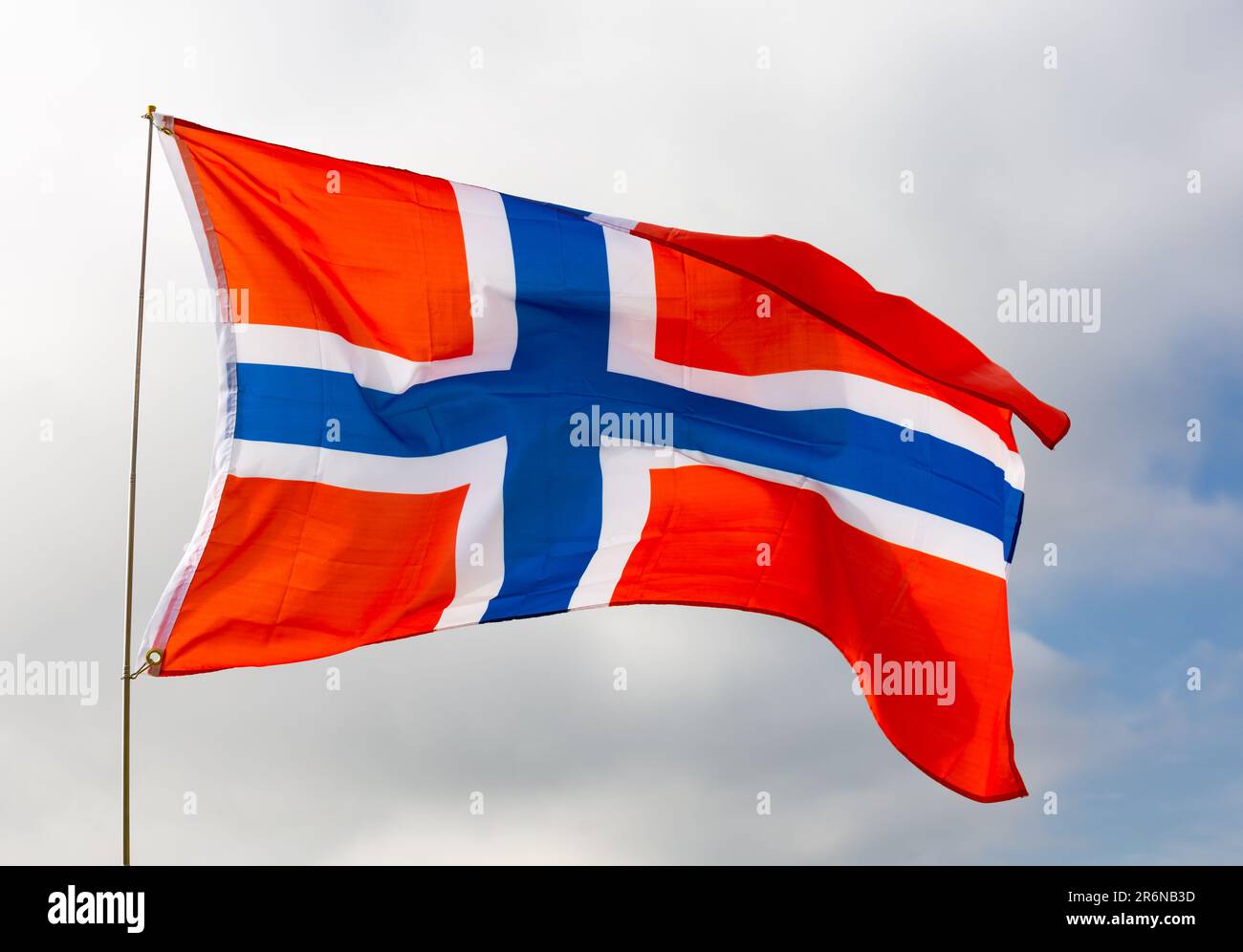 Flag of norway flying with pride with blue sky as background Stock ...