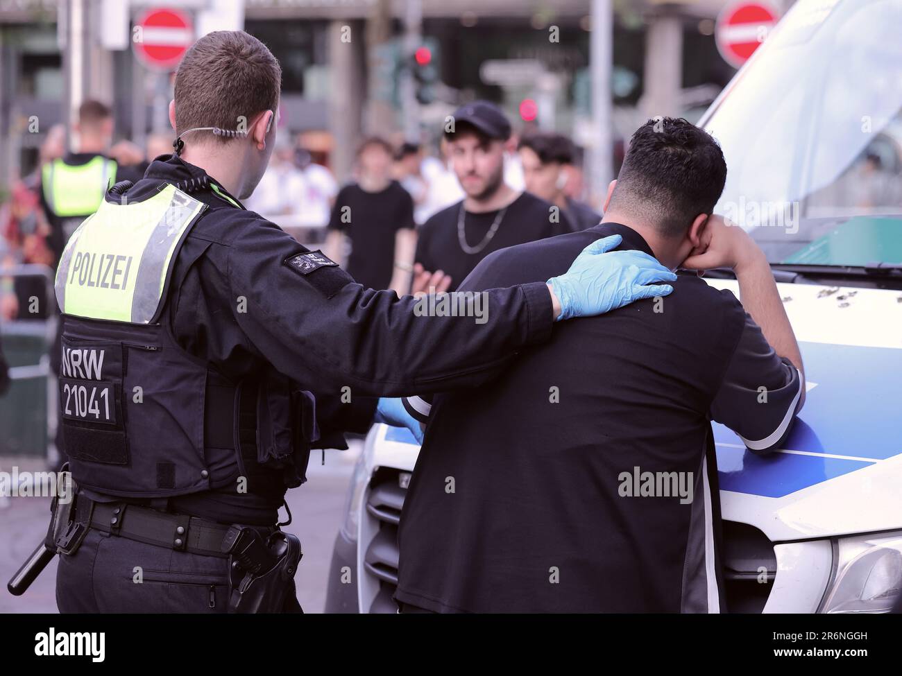 Duesseldorf, Germany. 10th June, 2023. Police officers search a person's bags during a police check. Police in several cities in North Rhine-Westphalia checked and searched for prohibited items such as knives, sharp weapons or drugs. Credit: David Young/dpa/Alamy Live News Stock Photo