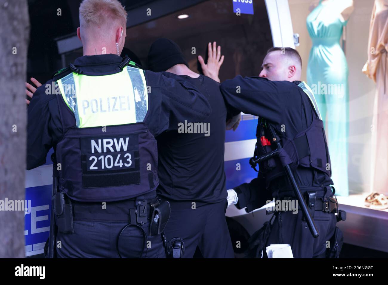Duesseldorf, Germany. 10th June, 2023. Police officers search a person's pockets during a police check. Police in several cities in North Rhine-Westphalia checked and searched for prohibited items such as knives, sharp weapons or drugs. Credit: David Young/dpa/Alamy Live News Stock Photo
