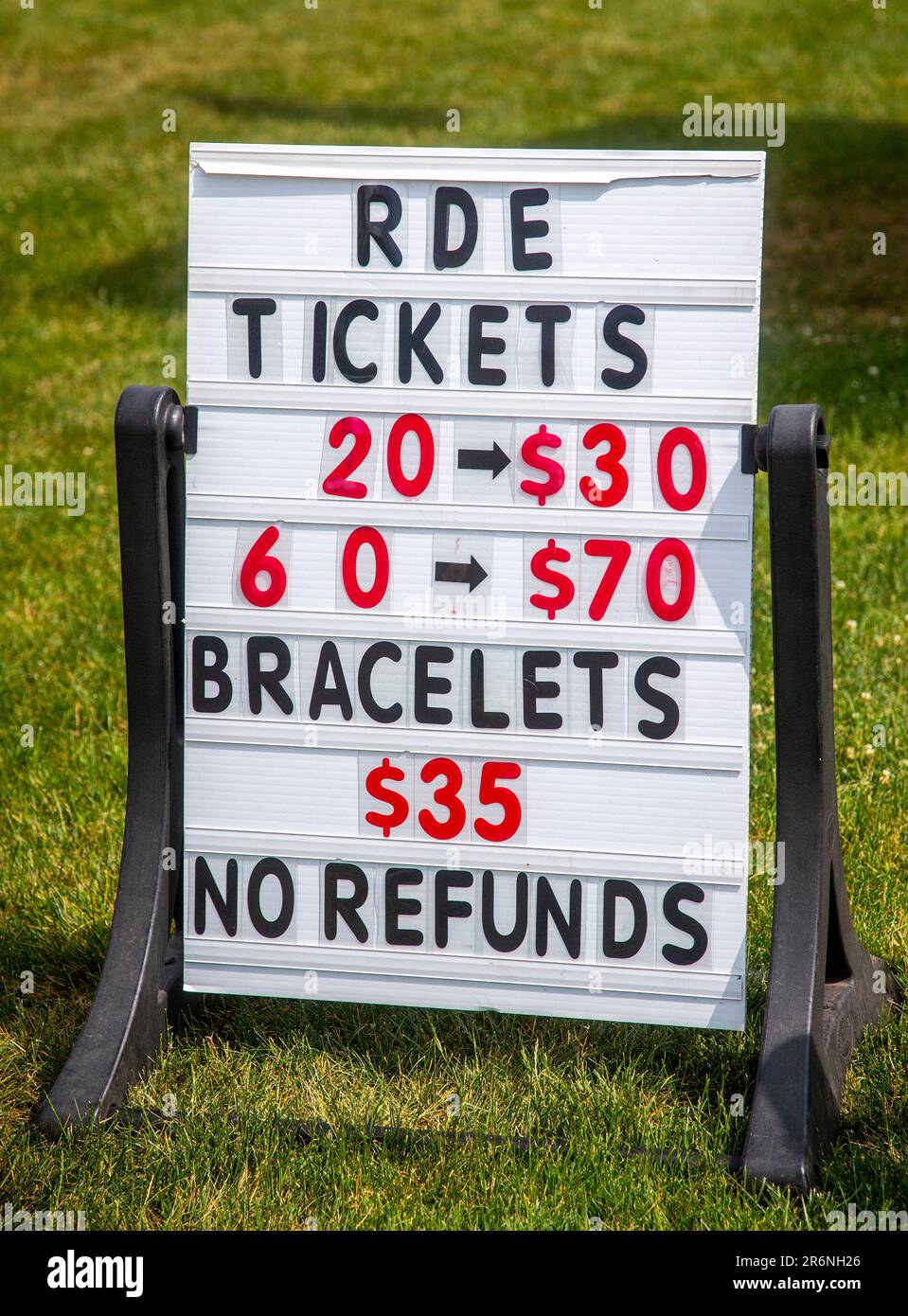 A sign showing ticket prices at a carnival Stock Photo