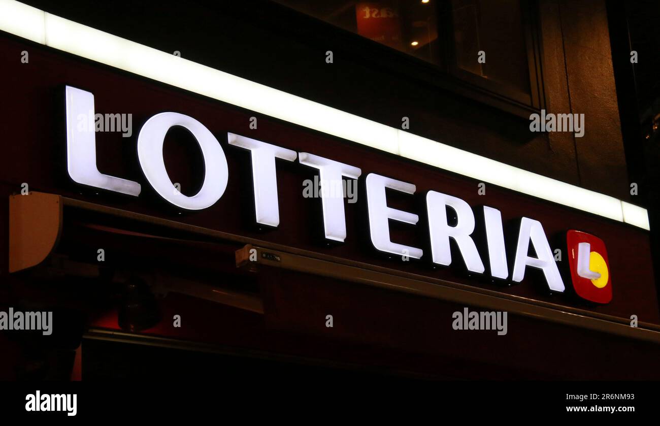 The logo of Lotteria is seen in Shinjuku Ward, Tokyo on June 15, 2022. Lotteria is a chain of fast food restaurant which is spreading to the whole country. Its menu includes typical fast-food items such as hamburgers, French fries and fried chicken.( The Yomiuri Shimbun via AP Images ) Stock Photo