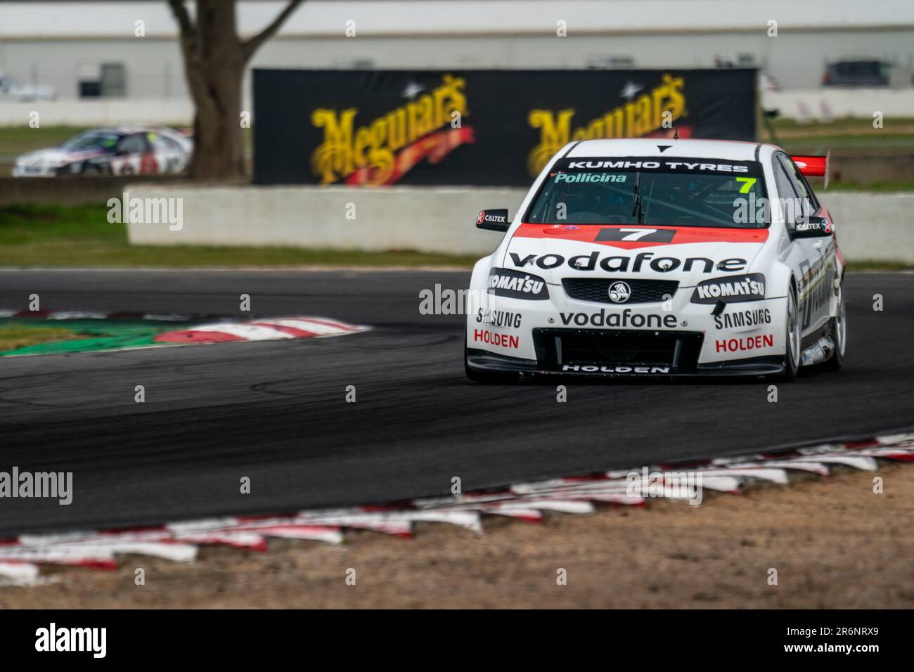 Winton, Australia. 10 June, 2023. Jim Pollicina (#7) accelerates out of turn 3 at Winton Motor Raceway in his Holden Commodore. Credit: James Forrester / Alamy Live News Stock Photo