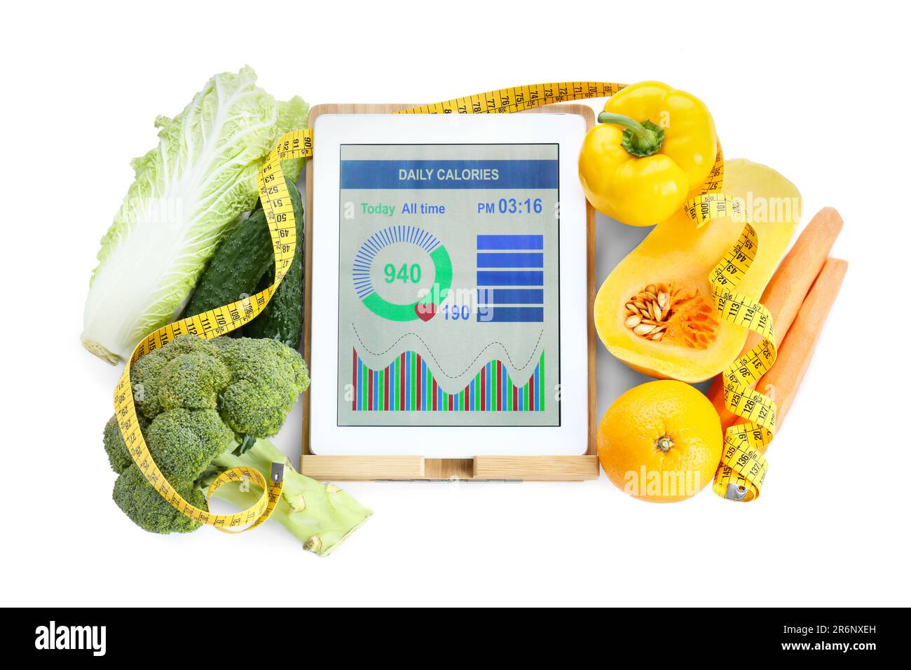 Tablet with weight loss calculator application and food products on ...