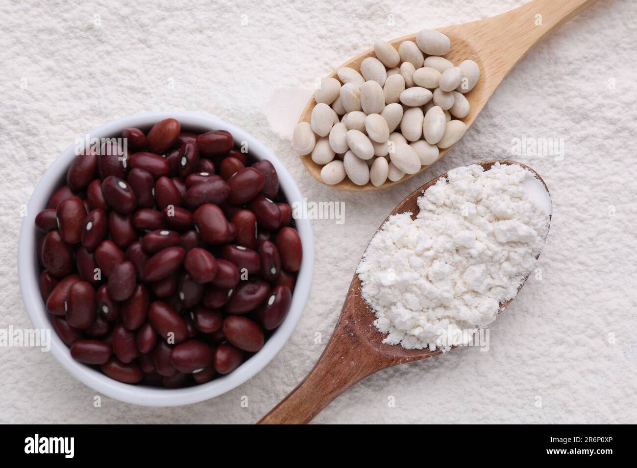 Different seeds on kidney bean flour, flat lay Stock Photo Alamy
