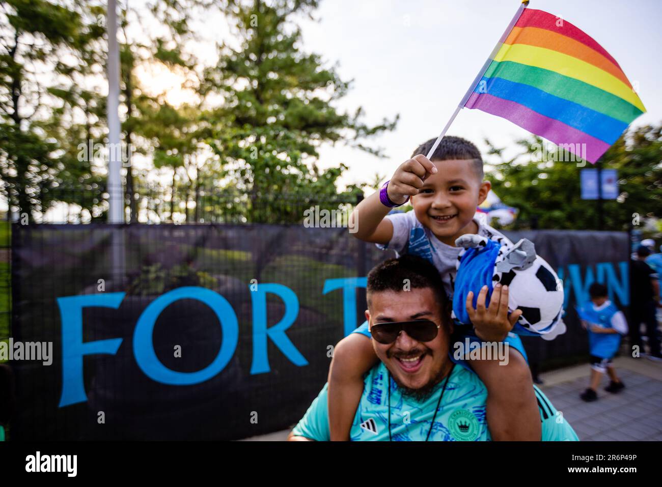 Charlotte, NC, USA. 10th June, 2023. young Charlotte FC fan celebrates pride month with his father as he marches to the match against Seattle Sounders in the Major League Soccer match up at Bank of America Stadium in Charlotte, NC. (Scott KinserCal Sport Media). Credit: csm/Alamy Live News Stock Photo